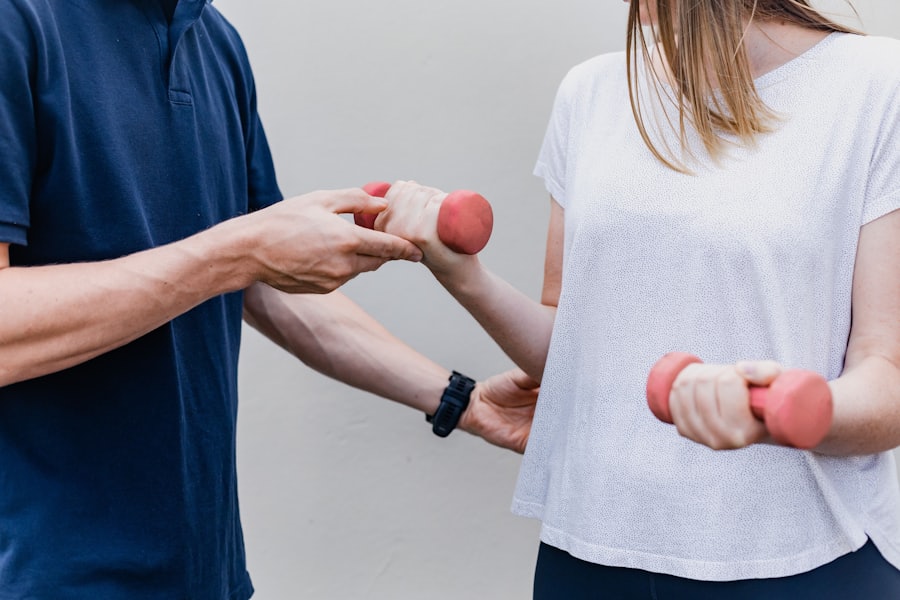Therapist guiding a patient through a supervised rehabilitation exercise